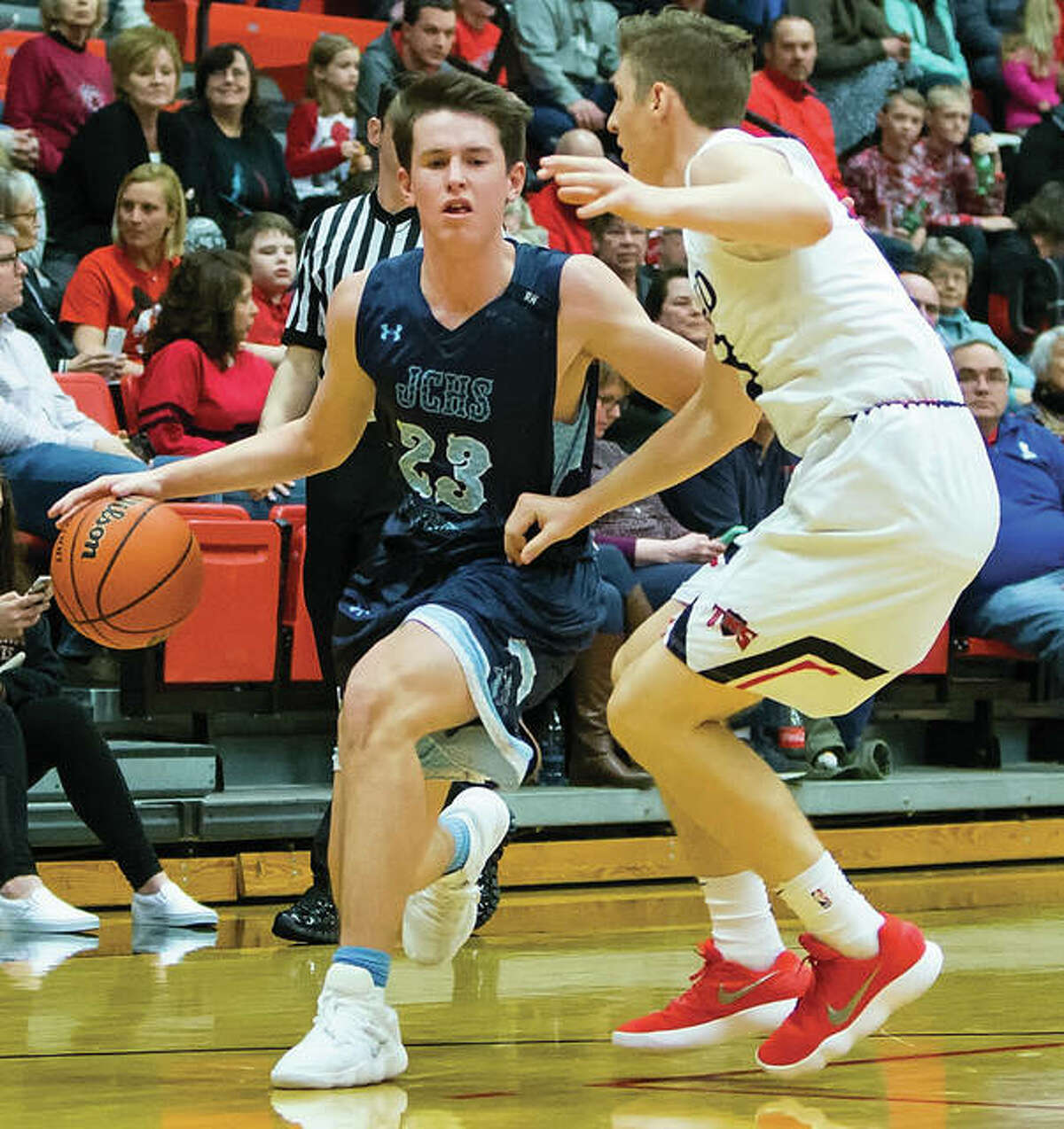 Jerseys Cody Gibson (left), shown driving on Triads Joe Wade during a Mississippi Valley Conference game Jan. 5 in Troy, and Panthers teammate Blake Wittman will be part of the West boys team in Sunday’s night’s prep basketball all-star game in Carlinville