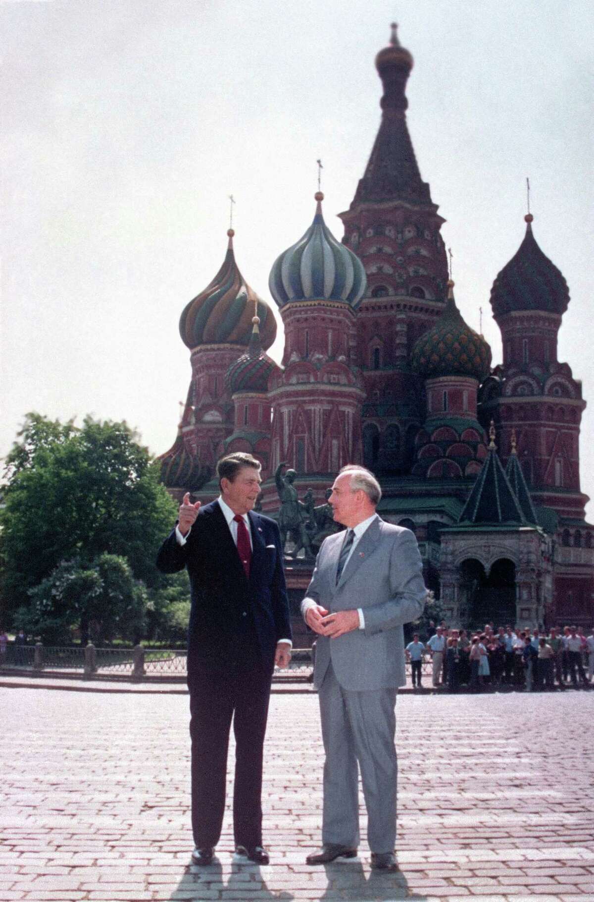 U.S. President Ronald Reagan, left, and Soviet leader Mikhail Gorbachev stand alone during an impromptu walk in Red Square in Moscow on May 31, 1988. In the background is St. Basil's Cathedral.
