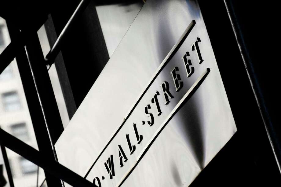 FILE - This July 15, 2013, file photo, shows a sign for Wall Street outside the New York Stock Exchange. The U.S. stock market opens at 9:30 a.m. EDT on Monday, March 19, 2018. (AP Photo/Mark Lennihan, File) Photo: Mark Lennihan / Copyright 2016 The Associated Press. All rights reserved. This m