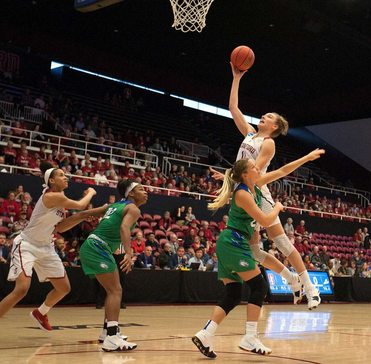 Stanford forward Alanna Smith (11) scores over Florida Gulf Coast guard Taylor Gradinjan (24) during the first half of an NCAA Division I Women's Basketball Championship game, on Monday, March 19, 2018 in Stanford, Calif.