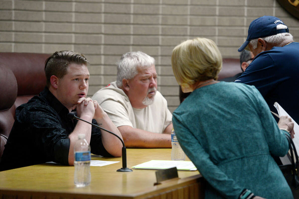 Groves City Councilman Cross Coburn, left, speaks with his attorney, Jill Pierce, after a meeting on Monday. Mayor Brad Bailey briefly addressed the topic of dating site photos of Coburn that were anonymously sent to the city and news outlets. Photo taken Monday 3/19/18 Ryan Pelham/The Enterprise