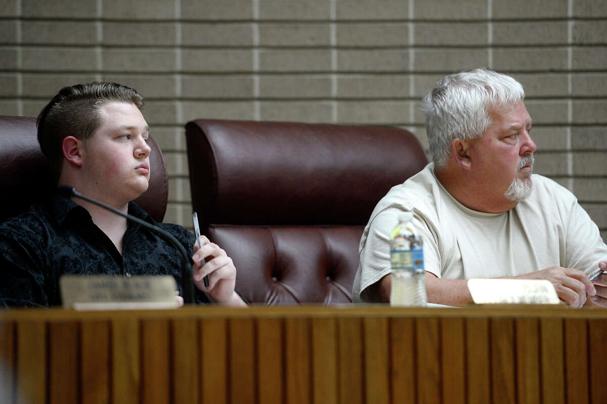 Groves City Councilmen Cross Coburn, left, and Sidney Badon listen during a council meeting on Monday. Mayor Brad Bailey briefly addressed the topic of dating site photos of Coburn that were anonymously sent to the city and news outlets. Photo taken Monday 3/19/18 Ryan Pelham/The Enterprise