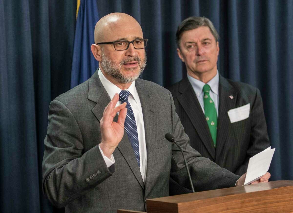 Stephen J. Acquario, Executive Director of the New York State Association of Counties, left, joins Albany County Comptroller Mike Conners in speaking at a press conference calling for internet taxes on sales to out of state firms even if they don't have a physical presence in New York State Tuesday March 19, 2018 at the Legislative Office Building in Albany, N.Y. (Skip Dickstein/Times Union)