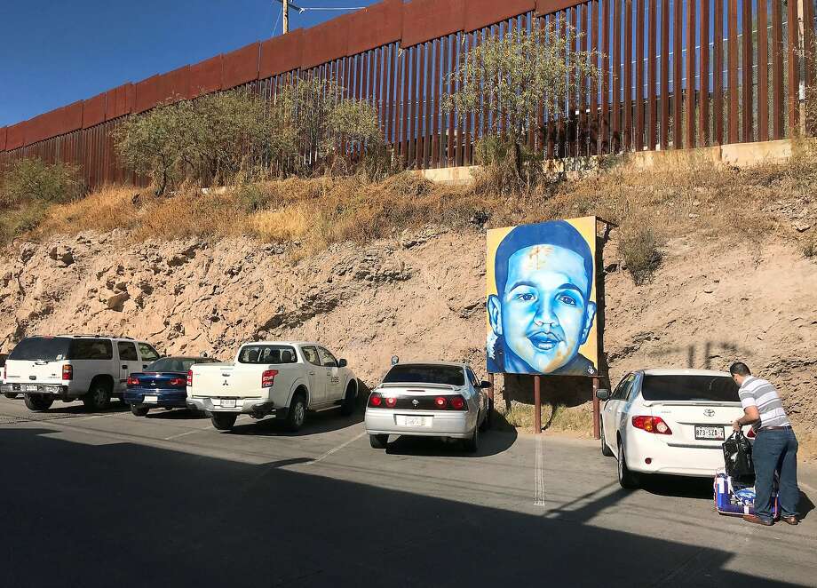 In this Dec. 4, 2017 photo, a portrait of 16-year-old Mexican youth Jose Antonio Elena Rodriguez, who was shot and killed in Nogales, Sonora, Mexico, is displayed on the street where he was killed that runs parallel with the U.S. border. A U.S. border patrol agent is going on trial for second-degree murder in U.S. District Court in Tucson on Tuesday, March 20, 2018, in a rare case Justice Department prosecution of a fatal cross-border Mexico shooting. Lonnie Swartz is charged with firing multiple shots from the Arizona side of the border into Nogales, Mexico more than five years ago and killing Rodriguez. (AP Photo/Anita Snow) Photo: Anita Snow, Associated Press