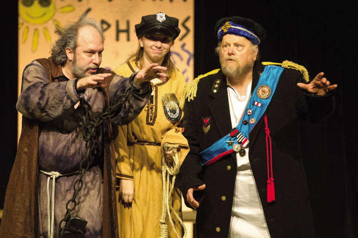 Director Sean Thompson, left, and cast members Quint Bishop, right, and Kayla Adams perform in "The Comedy of Errors" by William Shakespeare during the first Conroe Shakespeare Festival.