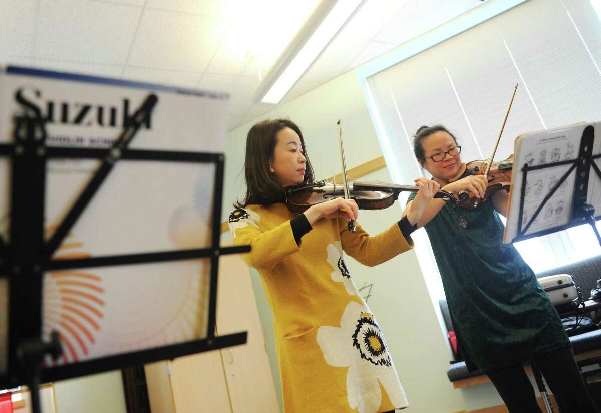 Photos from the Petite Concerts series featuring violinists Chi-Chi Lin Bestmann and Chie Yoshinaka at Greenwich Library in Greenwich, Conn. Tuesday, March 20, 2018. The concert series takes place once a month featuring interactive music for newborn- through preschool-aged children.