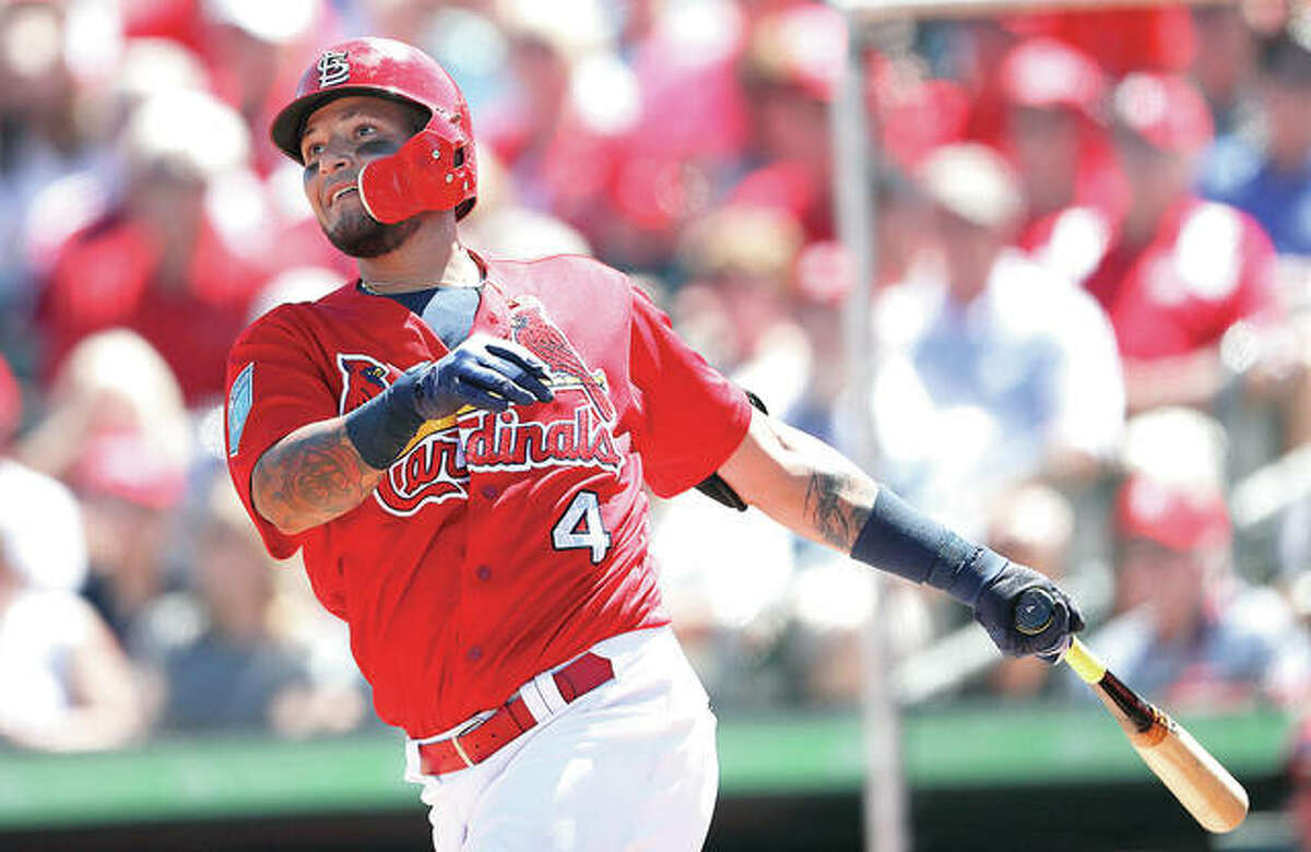 The Cardinals’ Yadier Molina drives in a run with a double in the fifth inning of a spring training game Friday against the Miami Marlins in Jupiter, Fla.