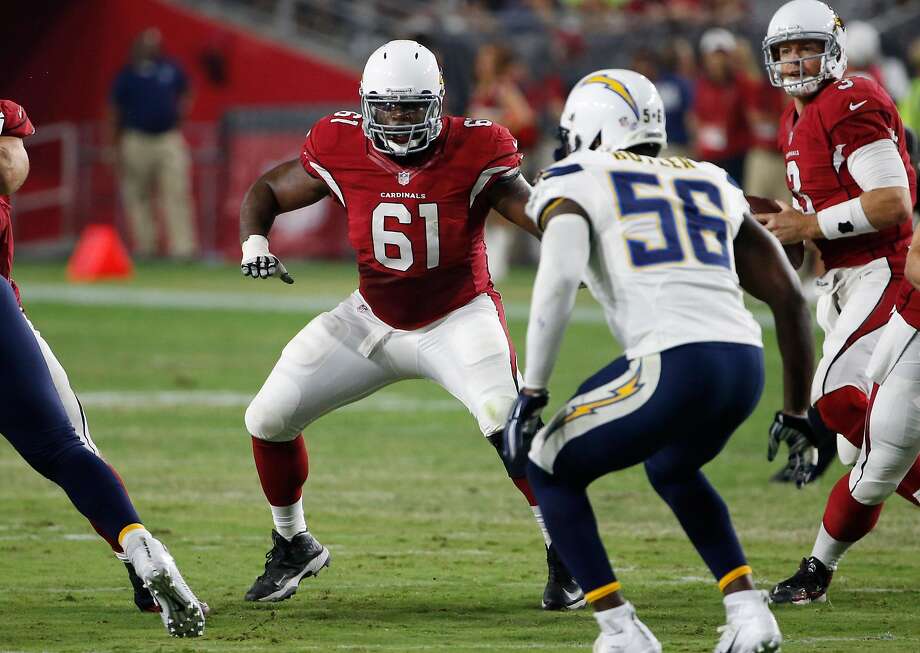arizona cardinals guard jonathan cooper (61) lines up against