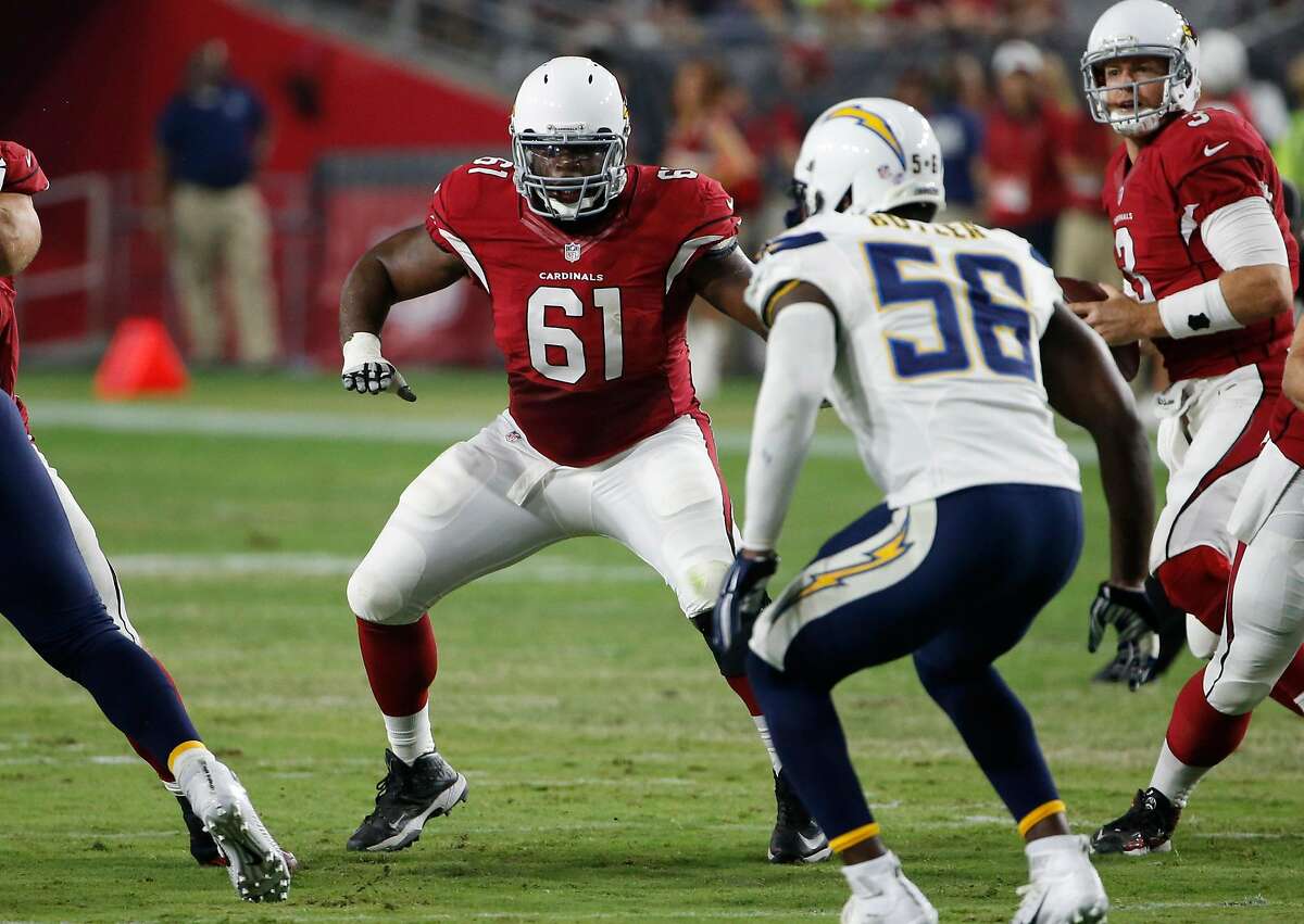 Arizona Cardinals guard Jonathan Cooper (61) lines up against the San Diego Chargers during the first half of an NFL preseason football game, Saturday, Aug. 22, 2015, in Glendale, Ariz. (AP Photo/Ross D. Franklin)