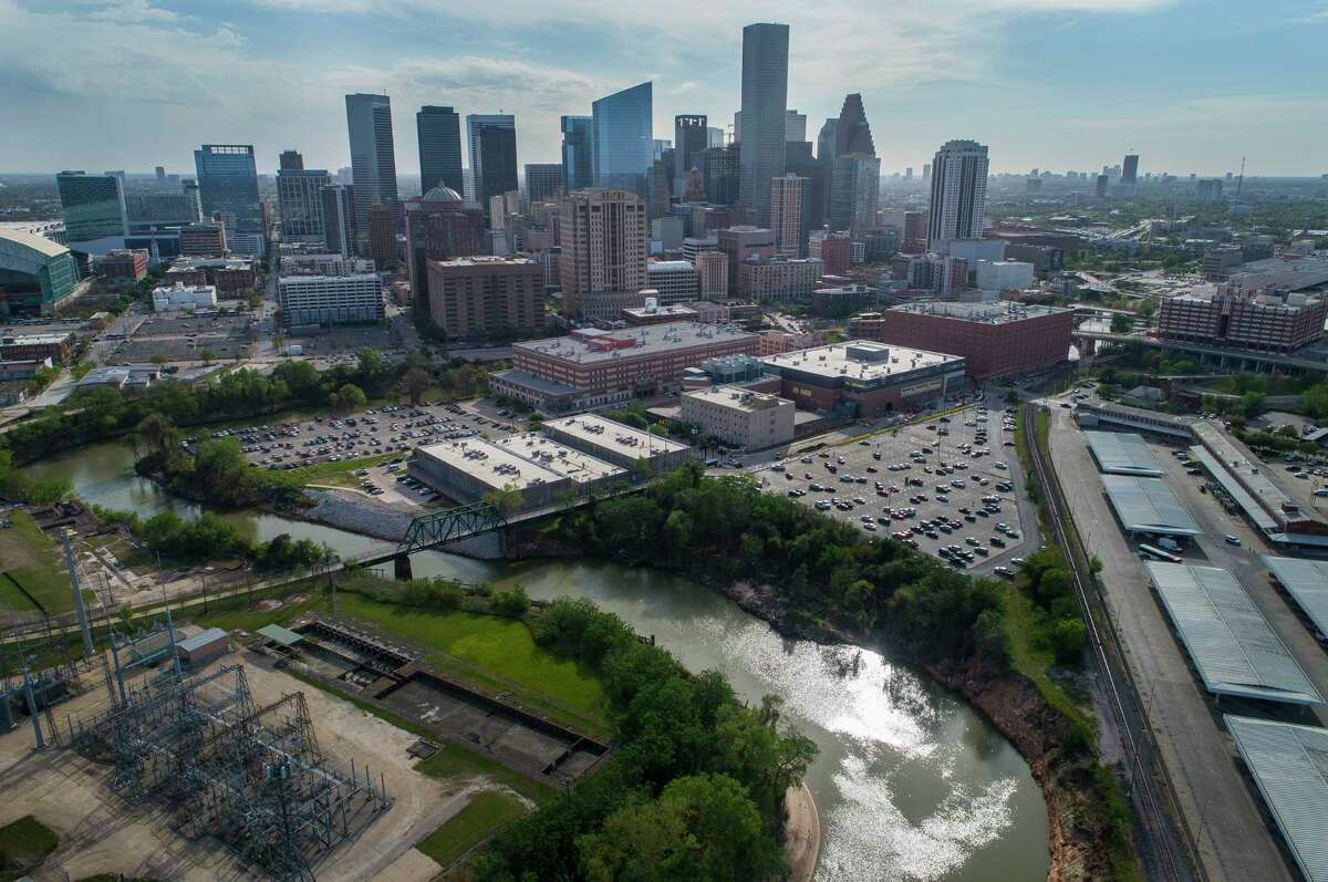The Buffalo Bayou bends around the Harris County Jail after being joined by White Oak Bayou at Allen's Landing next to the University of Houston Downtown, Monday, March 19, 2018, in Houston. A proposed canal would cut across the area north of the jail and connect White Oak Bayou to Buffalo Bayou sooner, hopefully mitigating flooding risk upstream. Mark Mulligan / Houston Chronicle )