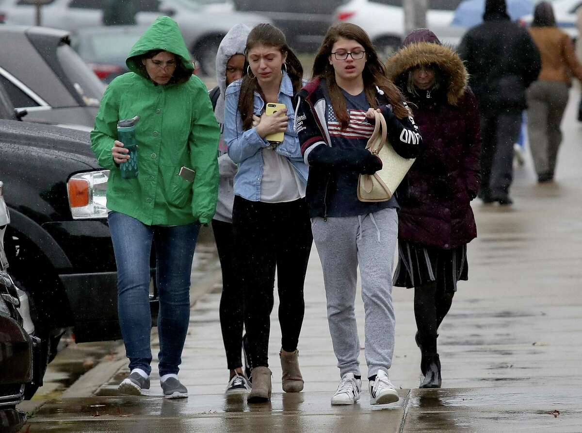 Students from Great Mills High School walk to meet their parents at Leonardtown High School following a school shooting at Great Mills High School March 20, 2018 in Leonardtown, Maryland.