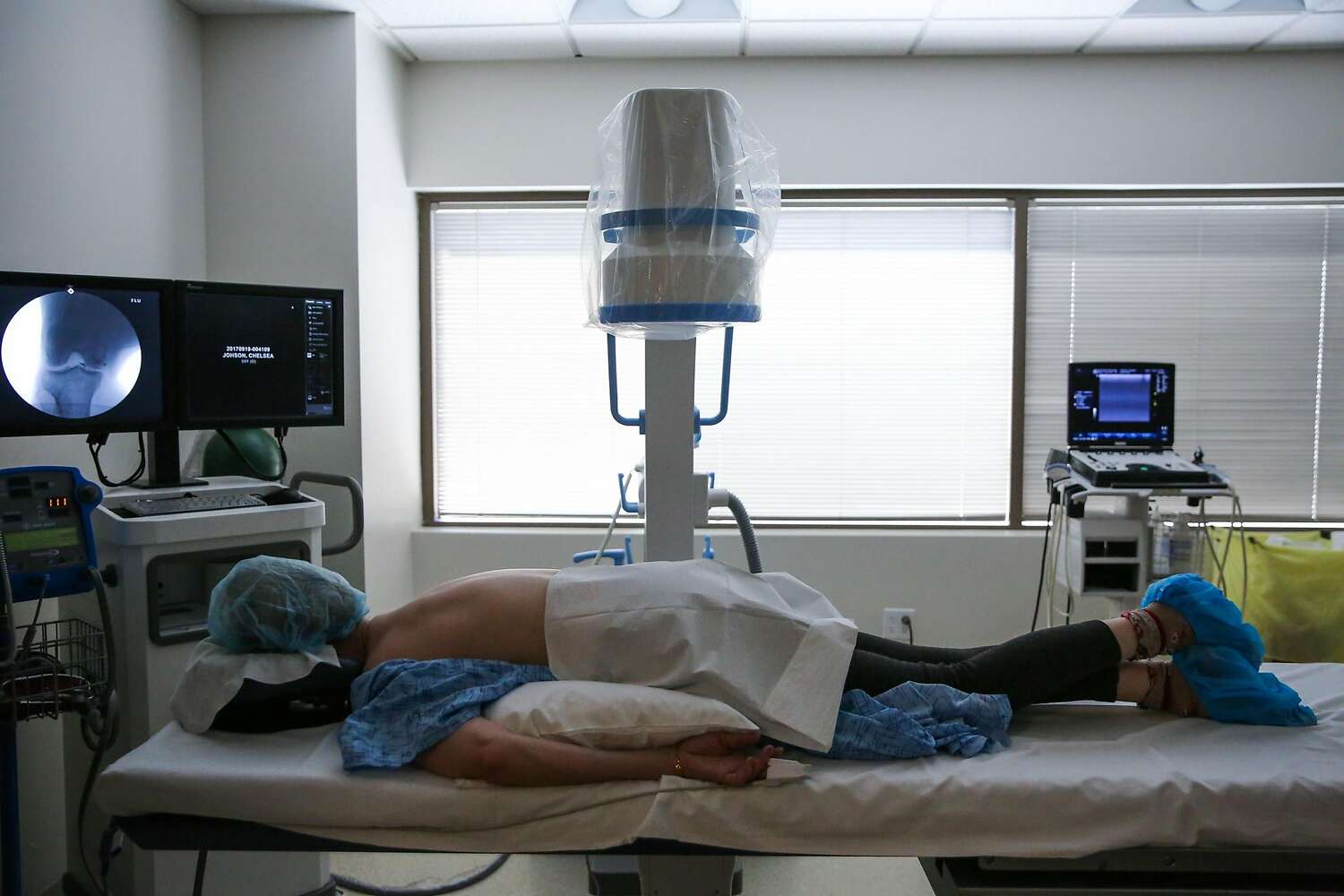 Shannon McCloud rests before a procedure at a stem cell clinic.