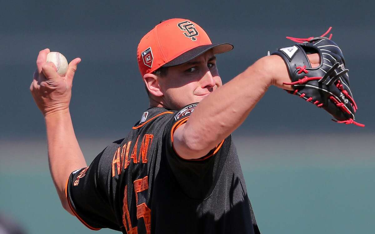 Texas Rangers starting pitcher Derek Holland works against the