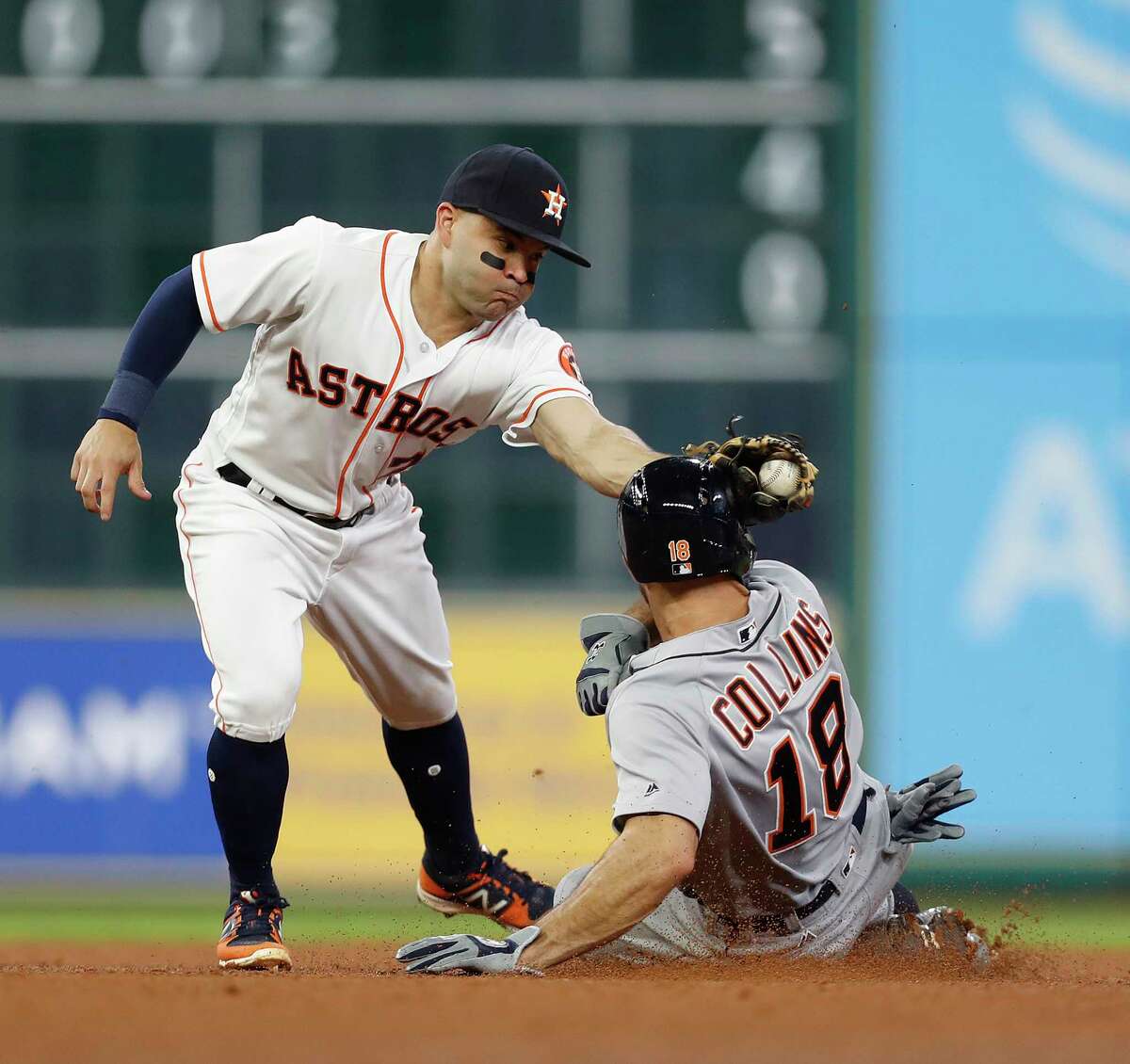 Jose Altuve is unable to catch the Tigers' Tyler Collins on a steal of second last season, a common occurrence for would-be thieves against the Astros' catchers.