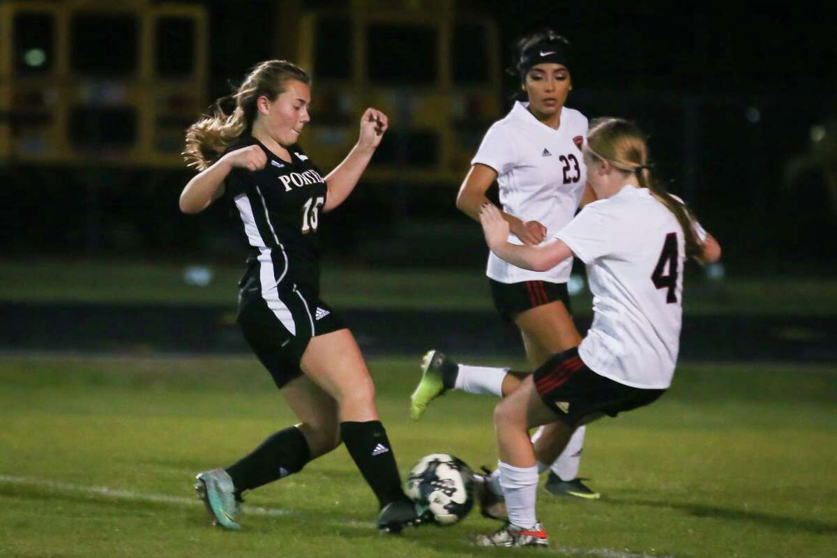 Porter's Atliy Kolodziejski (15) controls the ball as Caney Creek's Kylee Brankin (4) defends during the girls soccer game on Tuesday, March 20, 2018, at Caney Creek High School. (Michael Minasi / Houston Chronicle)