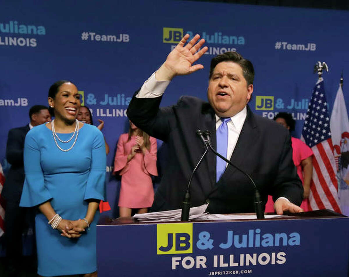Democratic gubernatorial candidate J.B. Pritzker, right, celebrates winning the Democratic gubernatorial primary with lieutenant governor candidate Juliana Stratton, Tuesday, March 20, 2018, in Chicago.