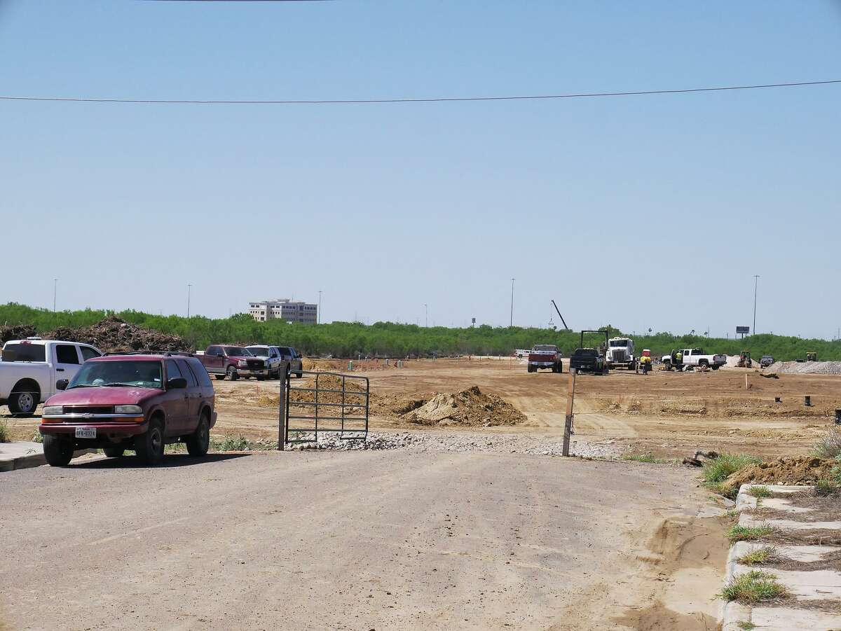 Crews work on a home development off Monaco Drive on Tuesday. The contractors involved in the project pushed past a 20-foot easement they were granted, and bulldozed 45-foot-wide swaths of wilderness in a few areas, an extra 0.58 acres of land, according to city records.