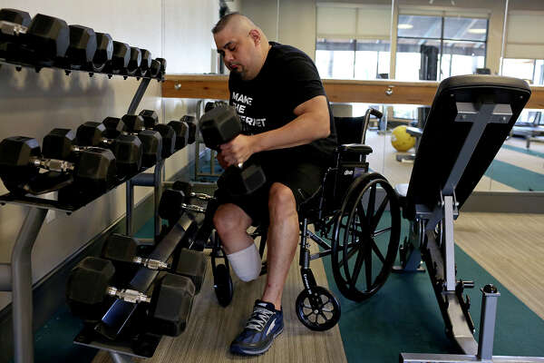Isaac Rodriguez exercises at his apartment complex's gym in San Antonio on March 12, 2018.