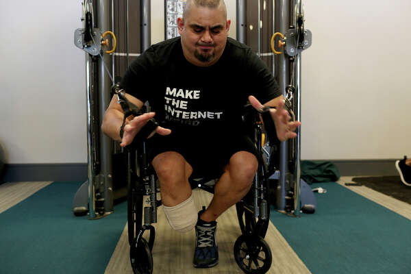 Isaac Rodriguez does strength work at his apartment complex's gym in San Antonio on March 12, 2018.