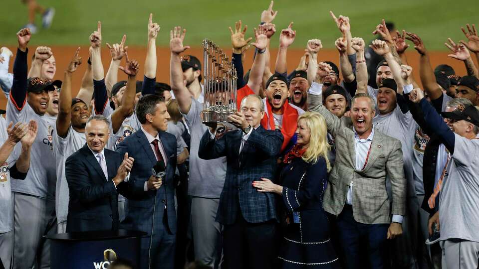 The Houston Astros hoist the World Series trophy as they celebrate beating the Los Angeles Dodgers 5-1 in Game 7 of the World Series at Dodger Stadium on Wednesday, Nov. 1, 2017, in Los Angeles. The Astros took the Series 4-games-to-3 to capture the franchise's first title. ( Brett Coomer / Houston Chronicle )