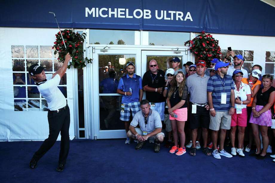 Matt Jones of Australia plays his second shot from the carpet of a hospitality tent during the third round of the 2015 PGA Championship at Whistling Straits on August 15, 2015 in Sheboygan, Wisconsin. Photo: Andrew Redington / Getty Images / 2015 Getty Images