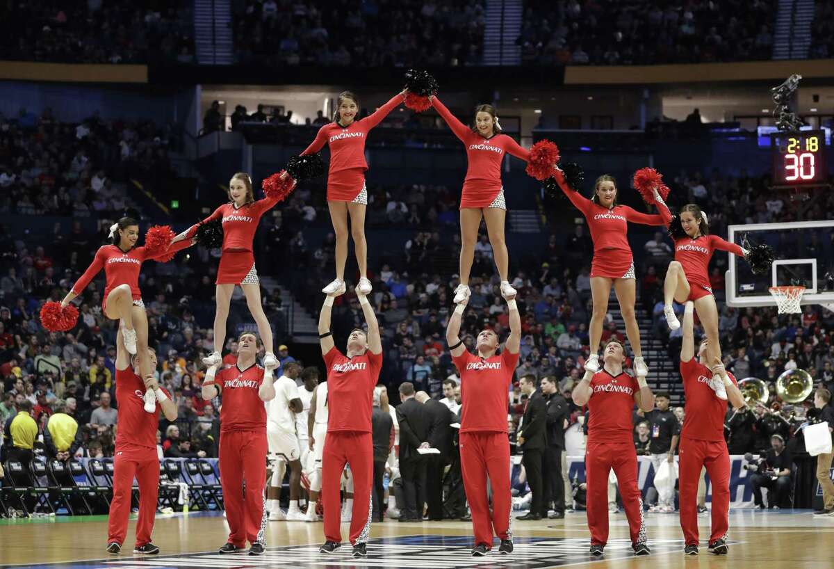 Cincinnati cheerleaders perform during the first half of a second-round game against Nevada, in the NCAA college basketball tournament in Nashville on Sunday.