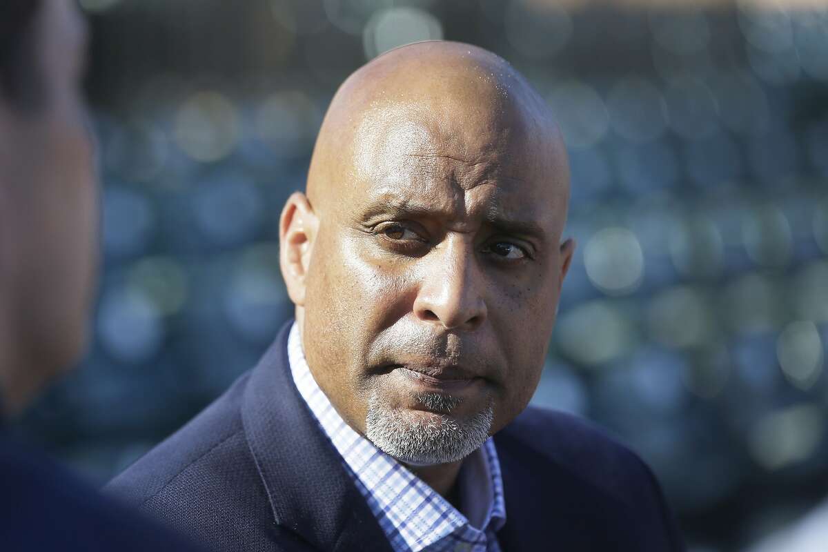 Major League Baseball Players Association executive and former Detroit Tigers first baseman Tony Clark talks to the media before a spring training exhibition baseball game between the Detroit Tigers and the Washington Nationals in Lakeland, Fla., Tuesday, March 17, 2015. (AP Photo/Carlos Osorio)