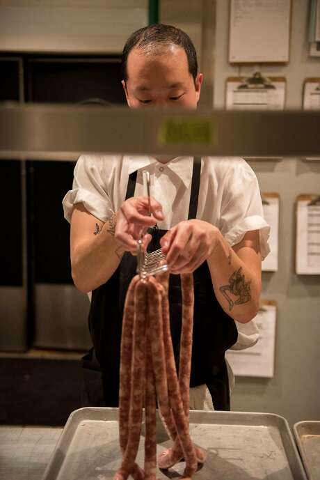 Eric Ehler prepares sausages at the end of his shift at Mr Jiu�s in San Francisco on March 21, 2018. Photo: Rosa Furneaux, Special To The Chronicle