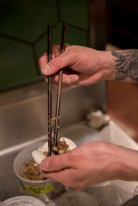 Eric Ehler stuffs dumplings at the end of his shift at Mr Jiu�s in San Francisco on March 21, 2018. Photo: Rosa Furneaux, Special To The Chronicle