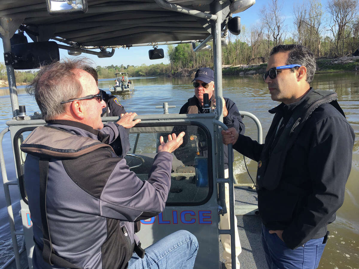 Council Member Dave Martin discusses the Lake Houston area's post-Harvey needs with Texas Land Commissioner George P. Bush during a boat tour along the San Jacinto River on Thursday, March 22.