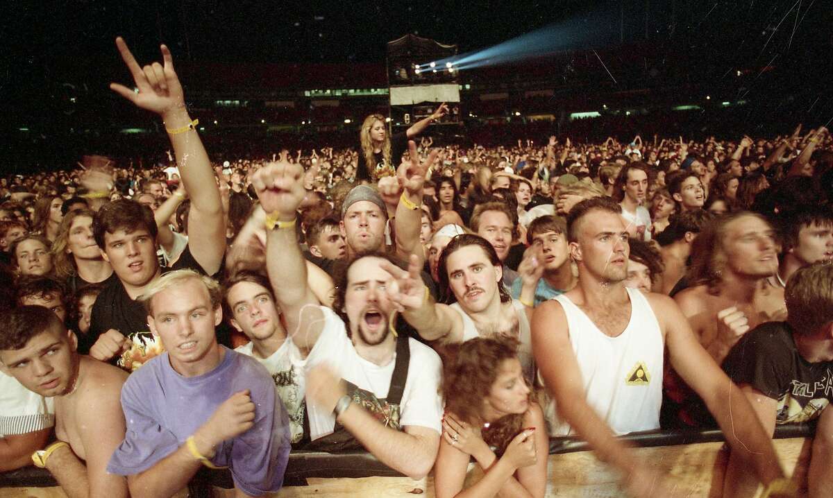 Fans show their support during Metallica's Day on the Green performance at the Oakland Coliseum on Oct. 12, 1991.