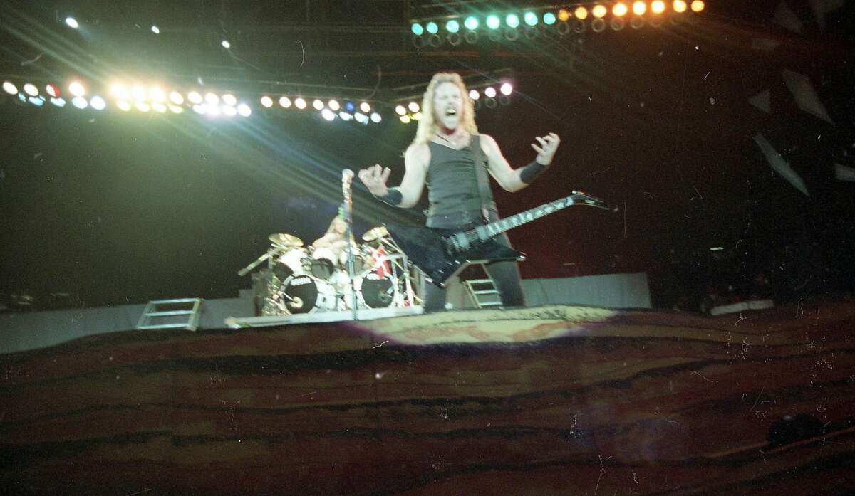 Singer/guitarist James Hetfield shows his enthusiasm during Metallica's Day on the Green performance at the Oakland Coliseum on Oct. 12, 1991.