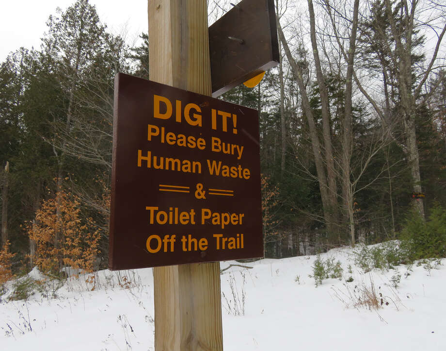 A sign near Upper Works in the Adirondack Park is part of the fight against toilet paper blooms. (Herb Terns/Times Union) Photo: Picasa