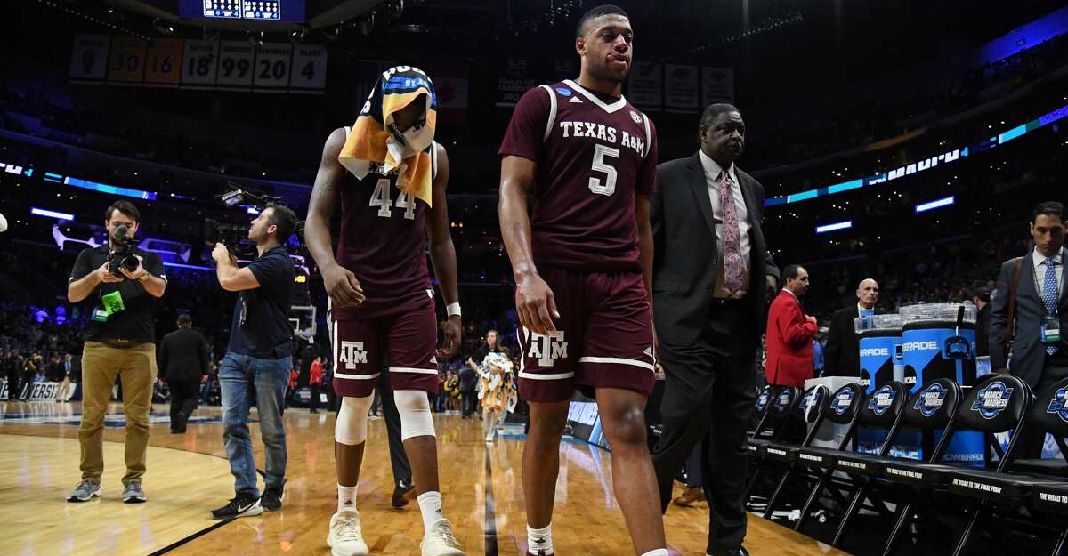 LOS ANGELES, CA - MARCH 22: Robert Williams #44 and Savion Flagg #5 of the Texas A&M Aggies walk off the court after their teams loss to the Michigan Wolverines in the 2018 NCAA Men's Basketball Tournament West Regional at Staples Center on March 22, 2018 in Los Angeles, California. The Michigan Wolverines defeated the Texas A&M Aggies 99-72. (Photo by Harry How/Getty Images)