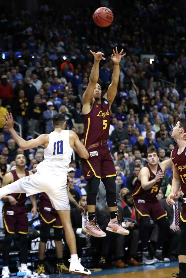 ATLANTA, GA - MARCH 22: Marques Townes #5 of the Loyola Ramblers shoots a three point basket late in the second half against Caleb Martin #10 of the Nevada Wolf Pack during the 2018 NCAA Men's Basketball Tournament South Regional at Philips Arena on March 22, 2018 in Atlanta, Georgia.  (Photo by Ronald Martinez/Getty Images) Photo: Ronald Martinez / 2018 Getty Images