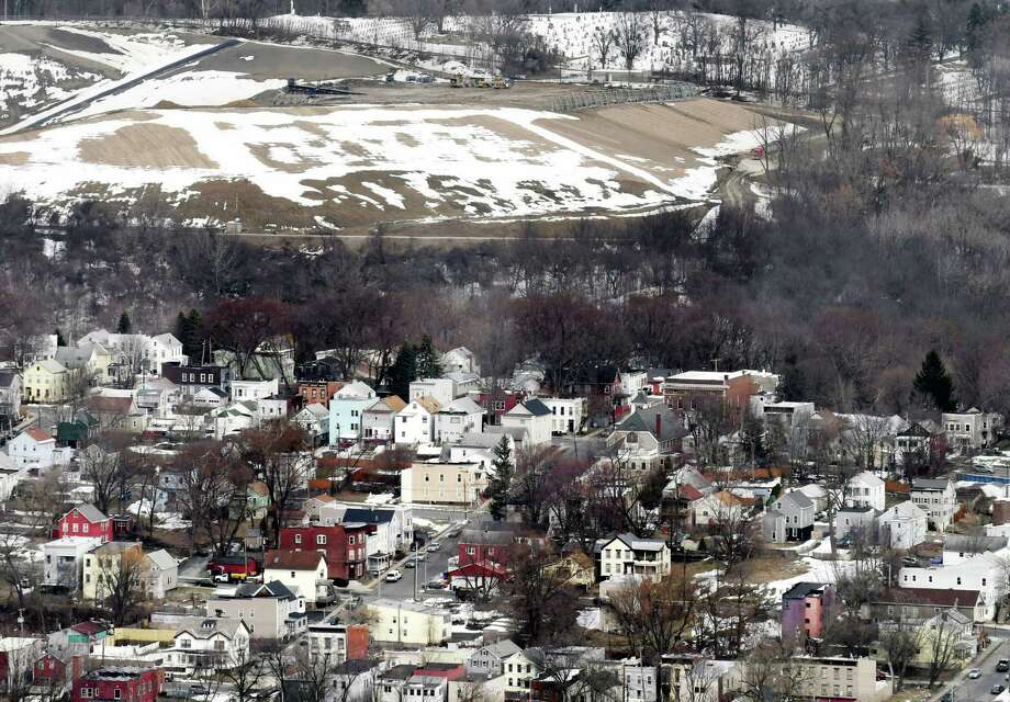 The Dunn C&D Landfill is visible above city houses on Tuesday, March 20, 2018, in Rensselaer, N.Y. In 2016, the landfill took in 407,975 tons of debris. (Will Waldron/Times Union) Photo: Will Waldron