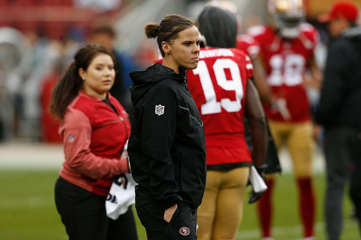 SANTA CLARA, CA - NOVEMBER 26: Seasonal Offensive Assistant Coach Katie Sowers looks on during the warm up before the game against the Seattle Seahawks at Levi's Stadium on November 26, 2017 in Santa Clara, California. (Photo by Lachlan Cunningham/Getty Images)
