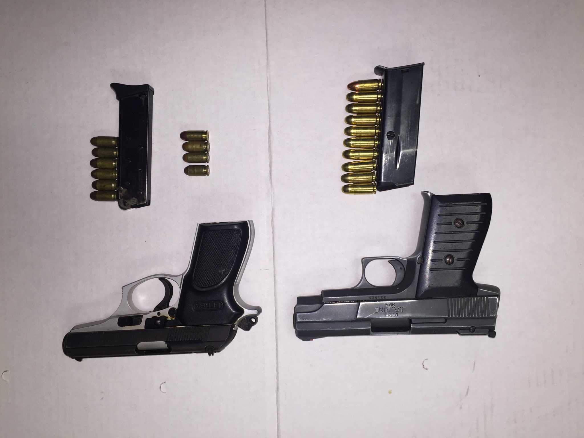Convicted felon allegedly caught carrying two guns in Stamford