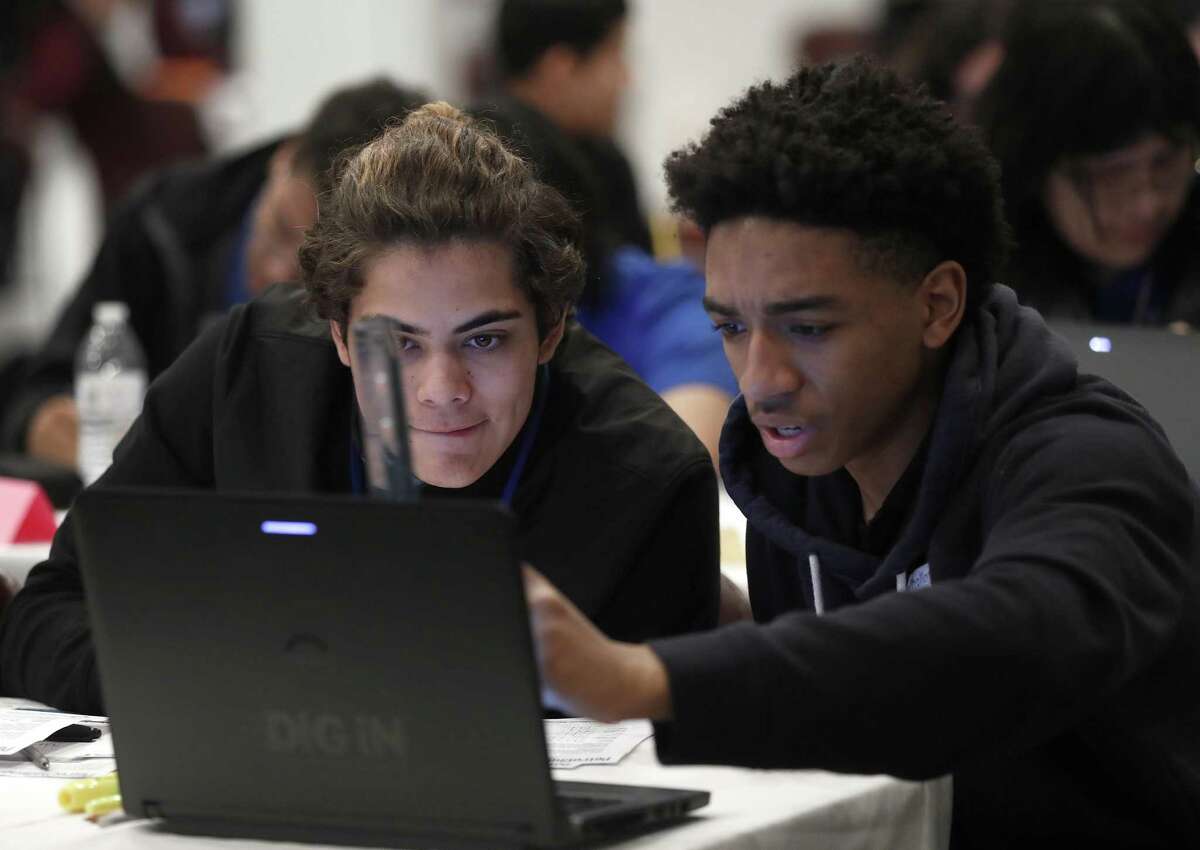 Ga'Juan Hickey, 17, uses a ruler to measure a 2-D seismic image, as he and Isaiah Valenzula, try to find prospects with the potential for oil and gas during the PetroChallenge at the Houston Community College SW Feb. 2 in Houston. Arts educations are a tried and true path to STEM careers.