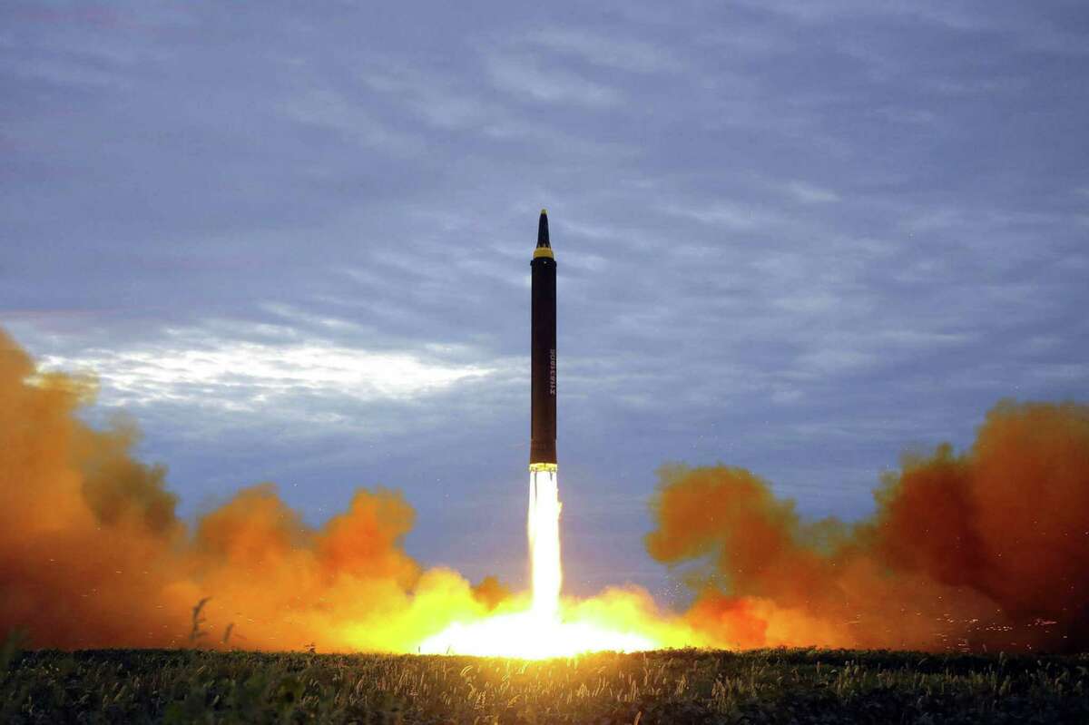 This Aug. 29 file photo shows what was said to be the test launch of a Hwasong-12 intermediate range missile in Pyongyang, North Korea. The historical track record indicates arbitration could be the road that sidesteps conflict on the Korean Peninsula.