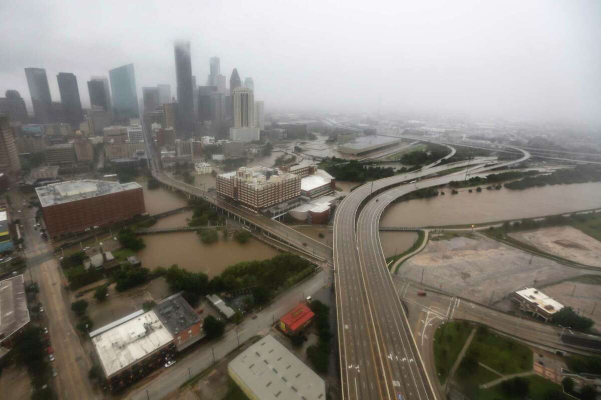 Downtown Houston is shown with Buffalo Bayou rising with floodwaters from Tropical Storm Harvey on Monday, Aug. 28, 2017, in Houston. ( Brett Coomer / Houston Chronicle )