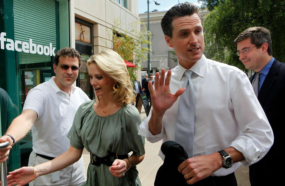 (left to right) Elliott Schrage, Facebook's vice president of communications and public policy, Jennifer Siebel, mayor Newsom's wife, San Francisco Mayor Gavin Newsom and Chris Kelly, Facebook's chief privacy officer and head of public policy, tour the company headquarters on Tuesday April 21, 2009 in Palo Alto, Calif., as the San Francisco Mayor officially announced his run for governor of California, on the internet using YouTube, Twitter and Facebook.