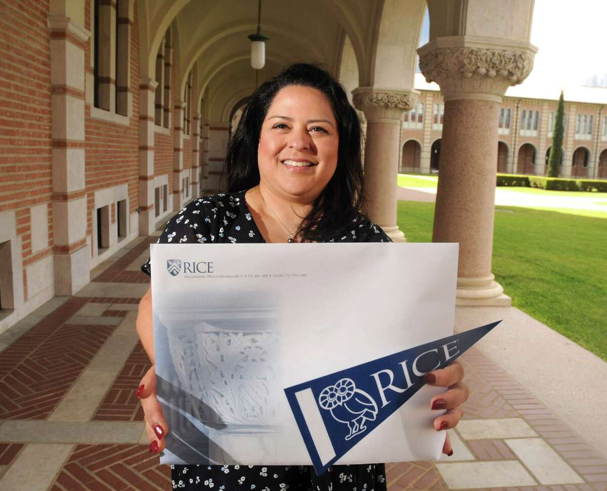 Rice University Vice President of Admissions Yvonne Romero da Silva with an acceptance package outside her office Friday March 23,2018. (Dave Rossman Photo)