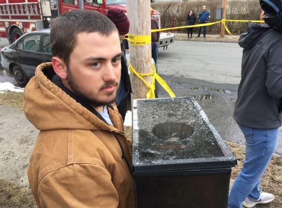 Firefighters retrieved a terrarium with a pet snake from the fire Photo: Rick Karlin/Times Union