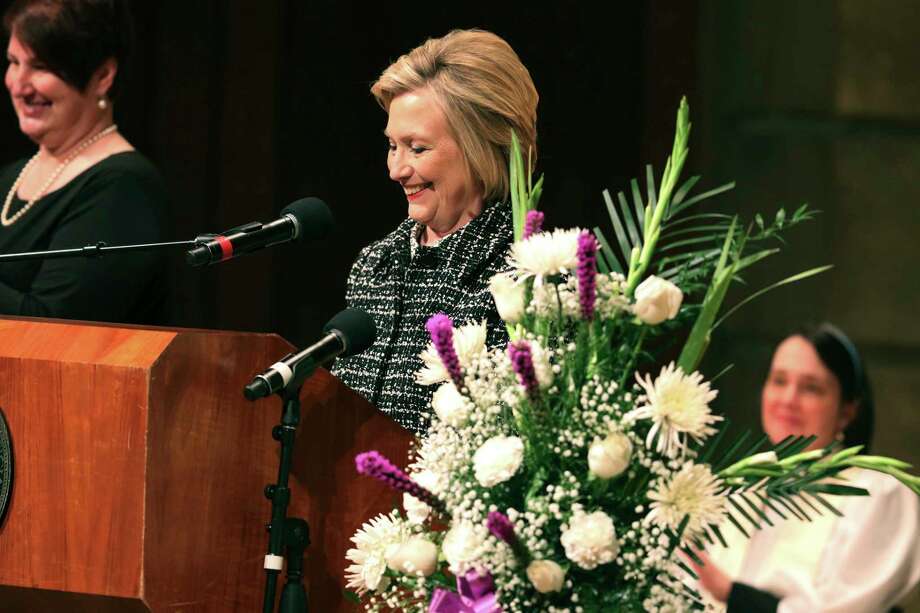 Former Secretary of State Hillary Rodham Clinton tells a funny memory of how after New York Congresswoman Louise Slaughter broke her leg, she told Clinton she had a new slogan, "vote for Louise, she has a leg up," during the funeral service for Slaughter at Kodak Hall at Eastman Theatre in Rochester, N.Y., Friday, March 23, 2018. (Tina MacIntyre-Yee /Democrat & Chronicle via AP) Photo: Tina MacIntyre-Yee / Democrat and Chronicle