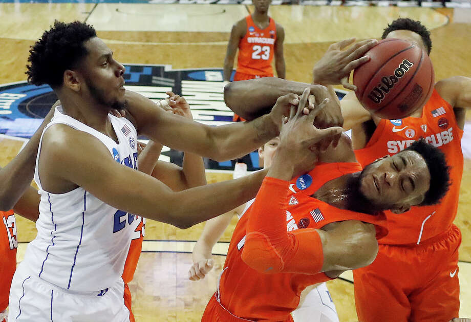 Syracuse's Oshae Brissett, right, and Duke's Marques Bolden reach for a rebound during the first half of a regional semifinal game in the NCAA men's college basketball tournament Friday, March 23, 2018, in Omaha, Neb. (AP Photo/Nati Harnik) Photo: Nati Harnik / Copyright 2018 The Associated Press. All rights reserved.