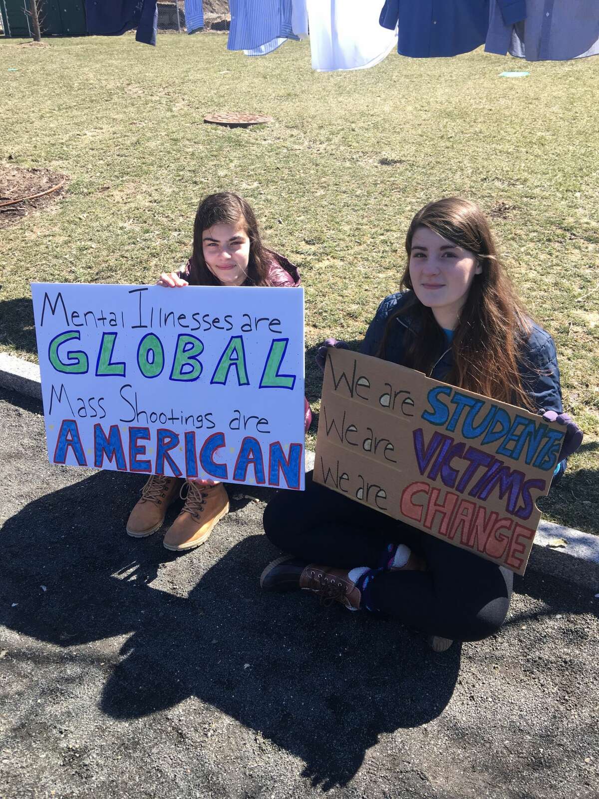 Rebecca Keyes (left) and Hannah Keyes (right), students at Norwalk High School, at the March for Our Lives in Stamford, Conn. on March 24, 2018.