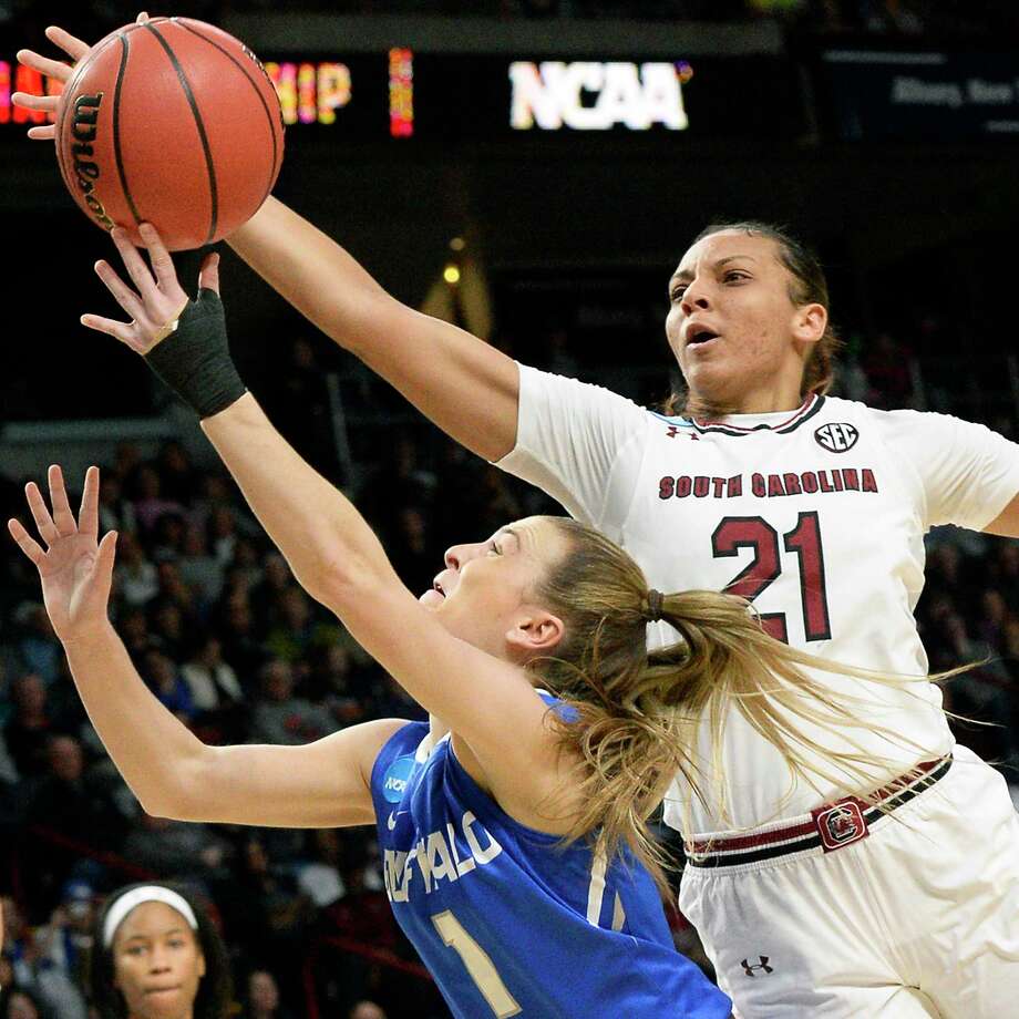 South Carolina's #21 Mikiah Herbert Harrigan, right, and Buffalo's #1 Stephanie Reid battle under the basket during their NCAA Women's Basketball Tournament regional semifinal at the Times Union Center Saturday March 24, 2018 in Albany, NY.  (John Carl D'Annibale/Times Union) Photo: John Carl D'Annibale, Albany Times Union / 20043167A