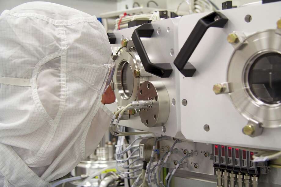 An employee at ASML's Wilton manufacturing facility where the company makes lithography machines used in computer chip manufacturing.