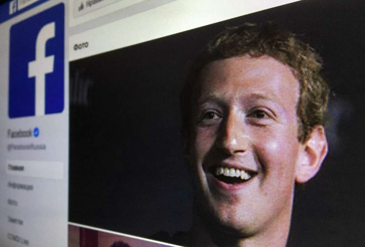 A picture taken in Moscow on March 22, 2018 shows an illustration picture of the Russian language version of Facebook about page featuring the face of founder and CEO Mark Zuckerberg. A public apology by Facebook chief Mark Zuckerberg, on March 22, 2018 failed to quell outrage over the hijacking of personal data from millions of people, as critics demanded the social media giant go much further to protect privacy. / AFP PHOTO / Mladen ANTONOVMLADEN ANTONOV/AFP/Getty Images